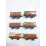 Hornby O-gauge - six assorted tin-plate carriages and a selection of various track