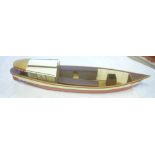 A wooden scale-built model pleasure craft 56" long