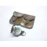 A Second War officers marching compass dated 1940 and a leather twin flap ammunition pouch (2)