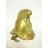 An old brass Merryweather pattern fireman's helmet with raised comb,