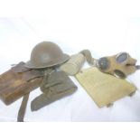 A Second War British steel helmet, gas mask, officer's webbing map case,