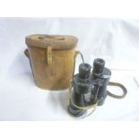 A pair of x7 Military binoculars in leather case dated 1944