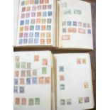 Four folder albums containing a collection of British Commonwealth and World stamps,