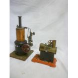 A copper and painted metal vertical steam boiler and a small Mamod steam engine (2)