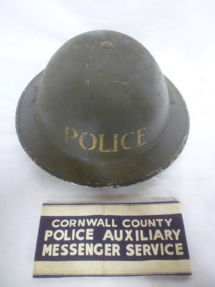 A Second War Cornwall Police Auxiliary Messenger Service armband with a Police steel helmet