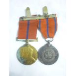 An Edward VII 1902 Coronation Metropolitan Police Medal and George V 1911 silver Metropolitan