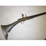 An 18th/19th Century North African Moukalha flintlock jezail musket with 46" steel barrel,