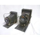 An Agfa standard folding camera with leather bellows and one other smaller Agfa standard folding