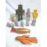 A selection of various battery operated and clockwork robots including Robot Lilliput,
