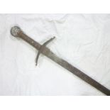 An old copy Medieval broad sword with double edged steel blade and leather bound steel hilt