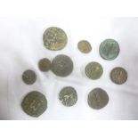 A selection of various Roman bronze coins and other ancient coins