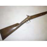 A 19th Century twelve-bore single barrelled percussion sporting gun with engraved steel lock and