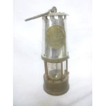 A brass and steel type 6 miner's lamp by the Protector Lamp & Lighting Co.