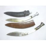 Two various Ghurka Kukris, one with curved blade and horn mounted hilt in leather sheath,