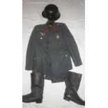 A copy German Second War Luftwaffe uniform jacket and trousers with attached badges together with