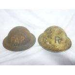 Two Second War Home Service helmets in relic condition "F.A.P.