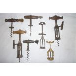 Seven various 19th Century and later corkscrews including two tap-action corkscrews,