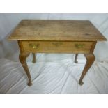 A 19th Century oak low boy with a single drawer in the frieze on cabriole legs with pad feet