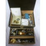 A jewellery box containing a quantity of various costume jewellery