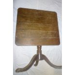 A 19th Century oak square tilt-top table on turned column with tripod base