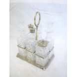 A late Victorian silver six-section cruet stand supporting six hob cut glass cruet bottles,