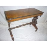 A Victorian inlaid walnut rectangular centre table on carved supports (af)