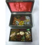 A jewellery box containing a quantity of various costume jewellery