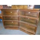 A pair of Globe Wernicke oak stacking three-tier bookcases with glazed folding fronts