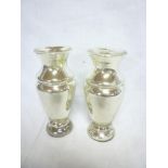 A pair of Victorian silvered glass baluster shaped spill vases,