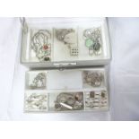 A jewellery box containing a selection of silver jewellery and costume jewellery