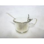 A Victorian silver circular mustard pot with blue glass liner, hinged lid & similar spoon,