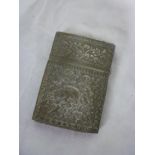 An Indian silvered rectangular visiting card case with raised animal and floral decoration