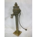 An old cast iron Irish village-style water pump by T & J Milliken of Belfast,