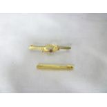 A 14ct plain gold bar brooch and a 9ct gold bar brooch set amethyst (2)