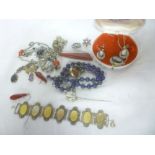 A selection of various costume jewellery including beadwork necklaces, horse stick pin,