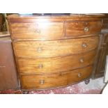 A Victorian mahogany bow front chest of two short and three long drawers with brass ring handles on