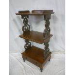 A Victorian mahogany three tier whatnot with pierced supports and base drawer