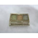 An Edward VII silver rectangular stamp case with hinged lid on decorated base,