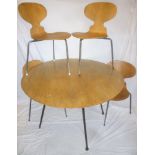 A 1960's polished walnut and laminate dining suite by Fritz Hansen,