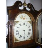 A 19th Century longcase clock with 12" painted arched dial and 30hour movement in oak traditional