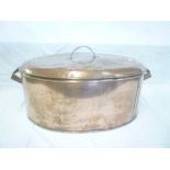 A large 19th Century copper oval two handled cooking pan & cover with loop handles,