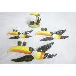 A set of three Carltonware china graduated Guinness Toucan wall plaques and a Carltonware Guinness