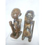 A pair of African carved wood male & female figures,