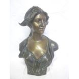 A bronzed plaster bust figure of a female after J Lambeaux,