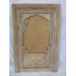 A large Middle Eastern carved sandalwood rectangular screen with central blank panel 61½" x 40"