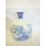 A Chinese tapered vase with painted blue and white bird and floral decoration,