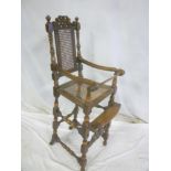 A good quality 1920's child's beechwood high chair with cane work seat and back on turned supports