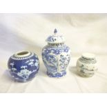 A 19th Century Chinese tapered vase and cover with blue and white painted decoration,