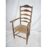 A 19th Century ash & beech ladder back open arm carver chair with string work seat on turned