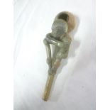 An unusual Aztec carved soapstone tribal pipe with raised figure decoration,